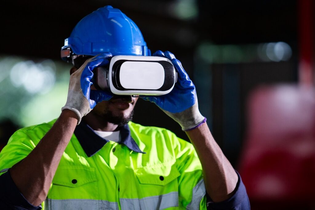 A construction worker utilizing generative AI technology while wearing a virtual reality headset.
