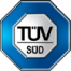 A blue octagonal badge with a silver interior displaying the text "TÜV SÜD.